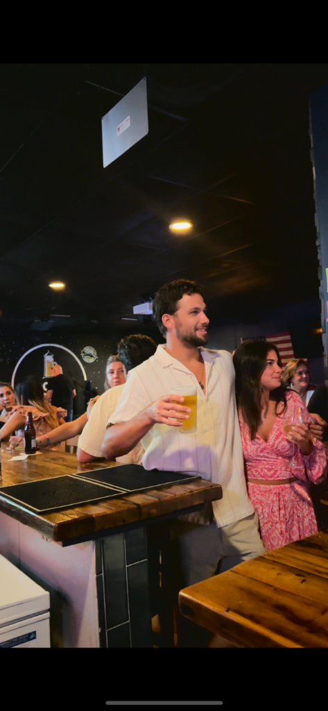 Private event bar scene at The Salty Zebra Bistro Jupiter Florida - guests socializing with full bar service