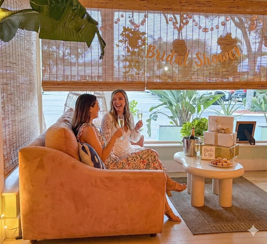 Bridal shower celebration at The Salty Zebra Bistro Jupiter Florida - ladies celebrating with champagne at daytime brunch event