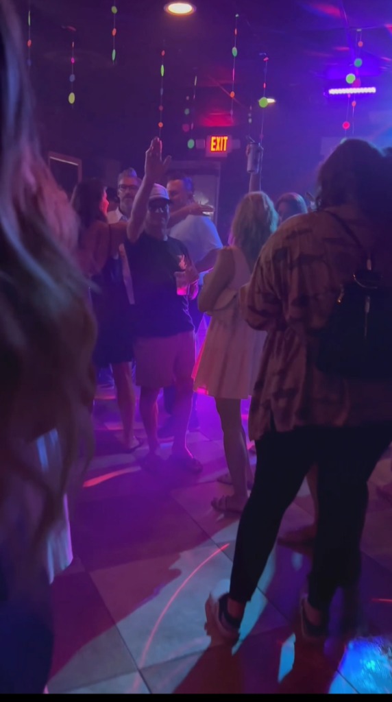 Private late-night party at The Salty Zebra Bistro Jupiter - dance floor with crowd and colorful lights